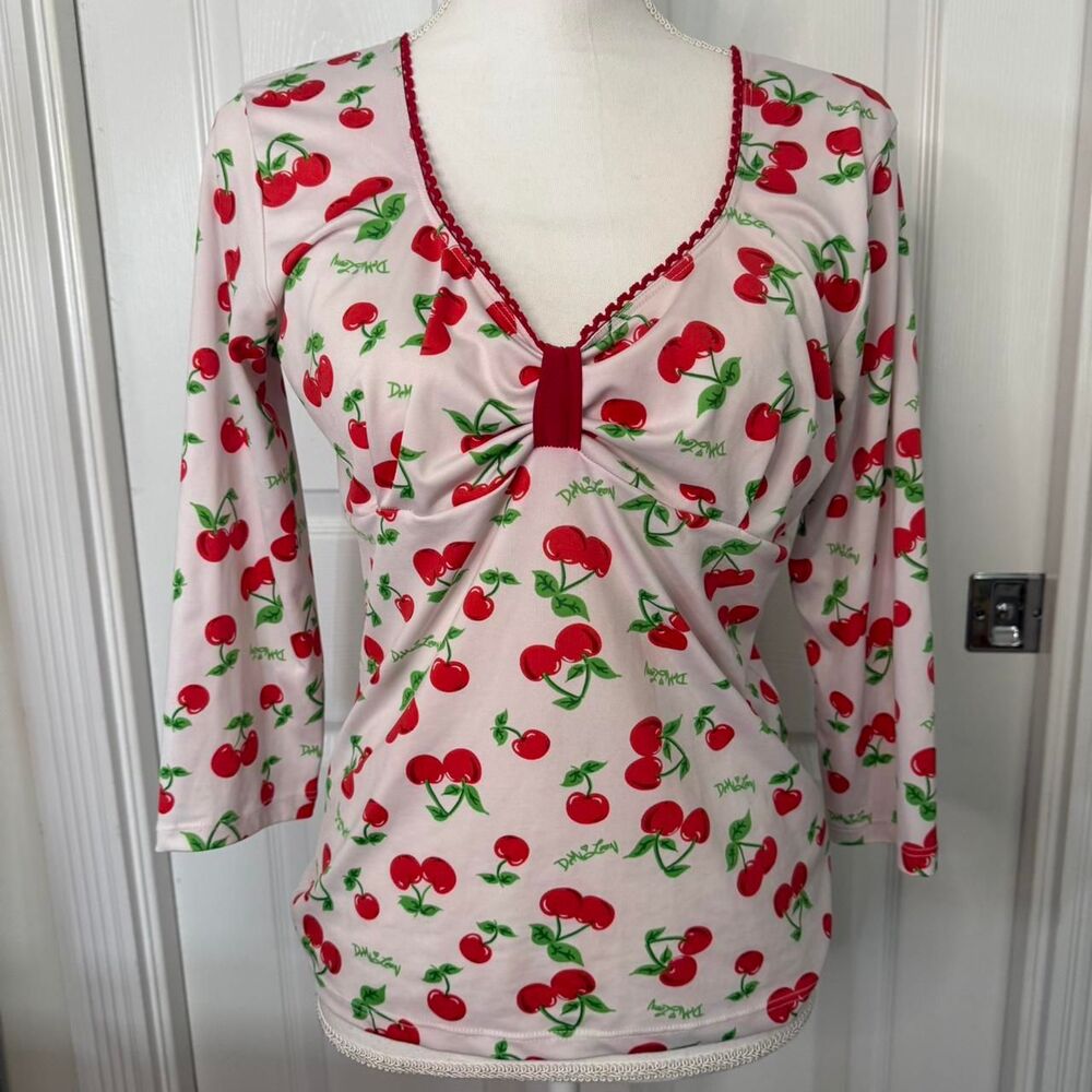 Demi Looney Cherry print 3/4 sleeve top with lettuce trim and V-neck.